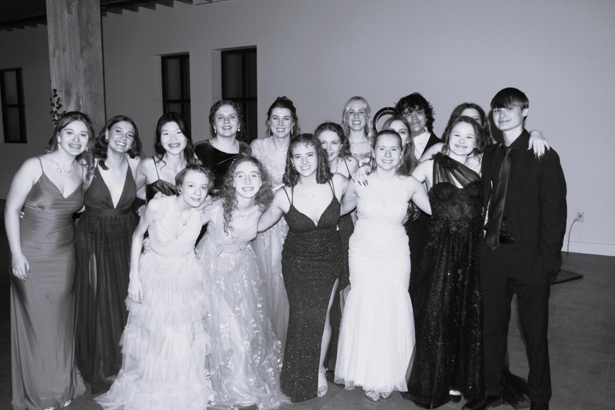 Formal group poses for a photo upon entering the venue. 