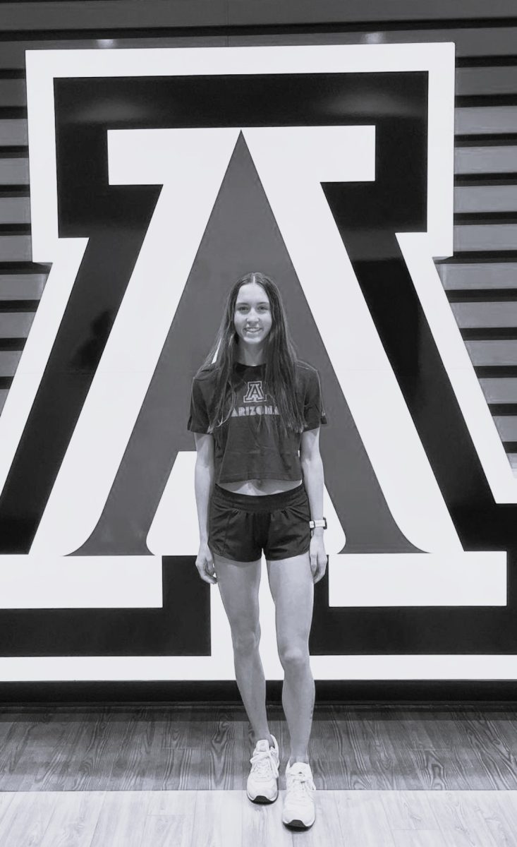 Pardy in front of the Arizona logo at the University of Arizona. 