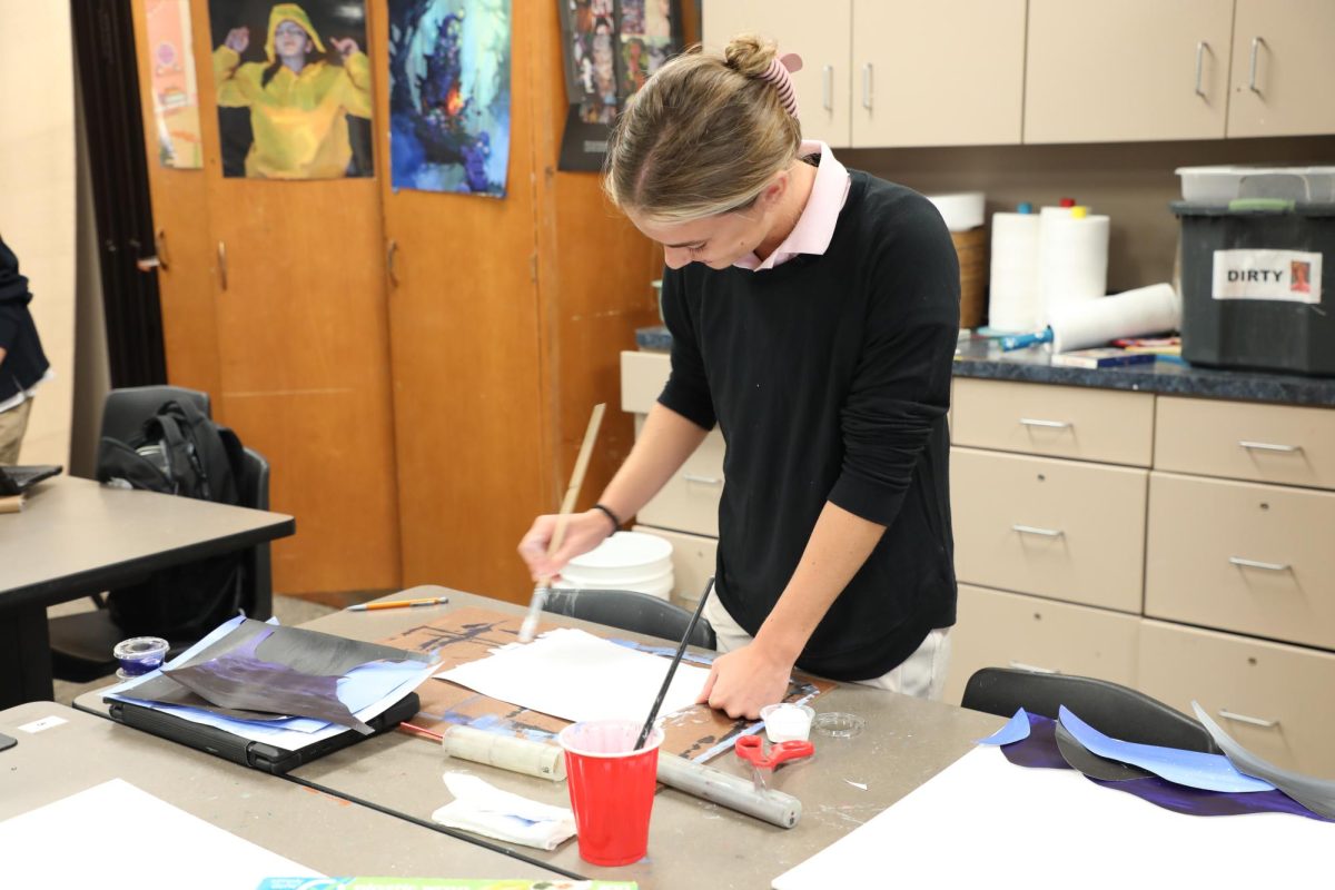 Shannon Heiman works in art class